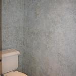 Linda Morgans Interiors, powder bath with troweled metallic and applied damask  artwork.