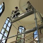 setting scaffolding for stairwell ceiling work.